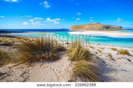Amazing view of Balos Lagoon with magical turquoise waters, lagoons, tropical beaches of pure white sand and Gramvousa island on Crete, Greece