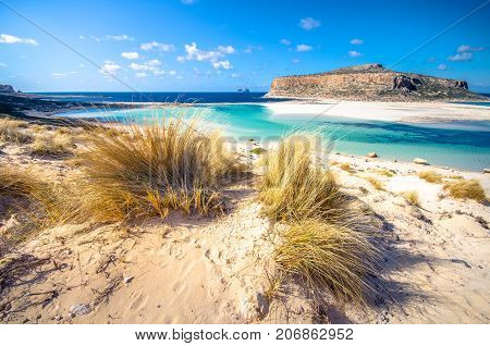 Amazing view of Balos Lagoon with magical turquoise waters, lagoons, tropical beaches of pure white sand and Gramvousa island on Crete, Greece