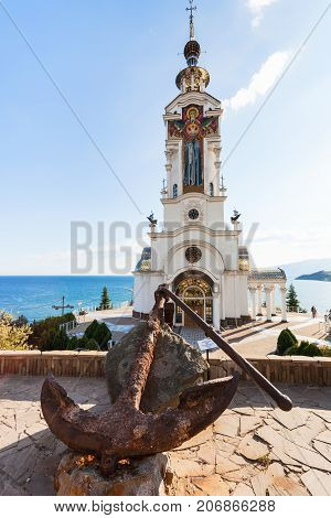Rusty Anchor And Church-lighthouse Of St Nicholas