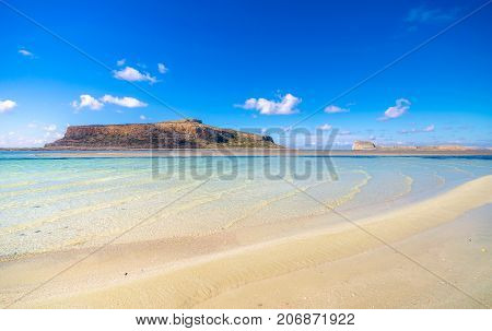 Amazing view of Balos Lagoon with magical turquoise waters, lagoons, tropical beaches of pure white sand and Gramvousa island on Crete, Greece