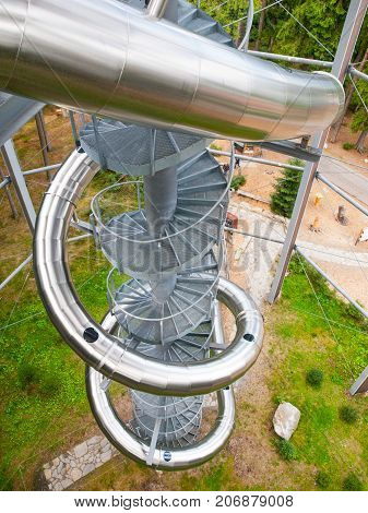 LIPNO NAD VLTAVOU, CZECH REPUBLIC - 26 September 2017. Spiral slide tube in the middle of The Treetop Walkway, Lipno nad Vltavou, Czech Republic.