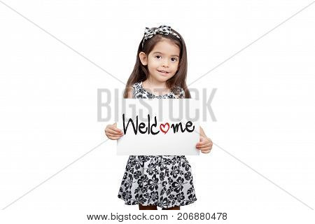 Business welcome concept Cute girl holding a welcome sign standing on white background. Cute mixed race girl half Thai half English model 3 years old.