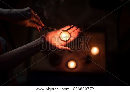 Tea ceremony with candles in the evening