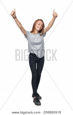 Teen girl in full length giving double thumb up sign, isolated on white background