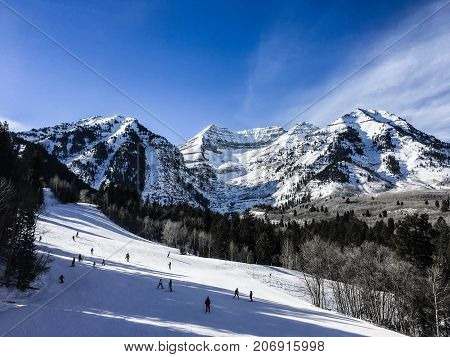 People Skiing Down A Mountain