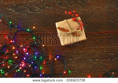 Christmas rustic background - vintage planked wood with lights and free text space.