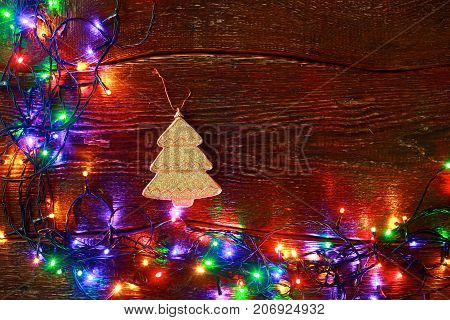 Christmas rustic background - vintage planked wood with lights and free text space.