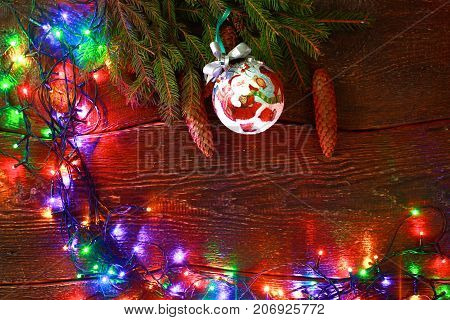 Christmas rustic background - vintage planked wood with lights and free text space.