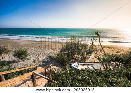 Tropical sandy beach of Ligres, Crete, Greece, with big waves.