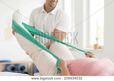 Physiatrist Performing Exercises With Patient