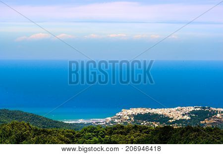 adriatic sea seascape panorama horizon with italian Peschici village in distance - Apulia - Gargano - Italy