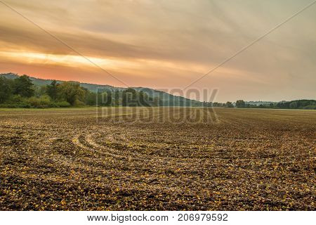 Scenic panorama of fall lawn with orange sunset skyline. Rural view from Sedmihorky Czech paradise Czech Republic