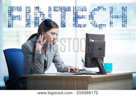 Businesswoman with computer in financial technology fintech conc