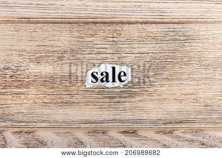 sale text on paper. Word sale on torn paper. Concept Image.