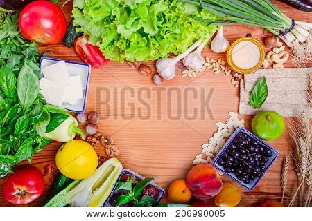 Selection of healthy food - vegetables, fruits, berries and cereals form a frame ov heart. Diet, detox, vegetarian concept. Love healthy life. Selective focus.Space foc text