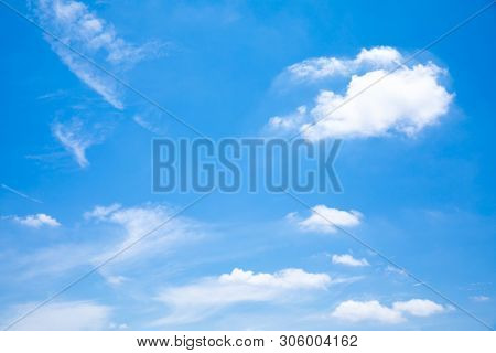 Deep Blue Sunny Sky With White Clouds. Blue Sky With Cloud Closeup. White Fluffy Clouds In The Blue 