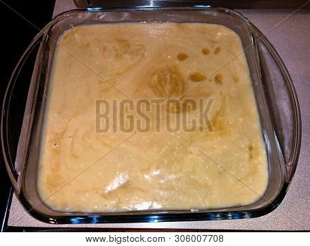 Philippine Dessert Topped With Coconut Milk And Sugar Ready For Baking In The Oven