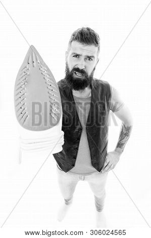 Preparing To Ironing. Bearded Man Holding Clothes Iron. Hipster With Electric Ironing Tool. Unshaven