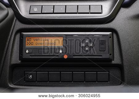 Digital Tachograph Display Reads Vehicle Overspeed. No Personal Data. Tachograph In A Van