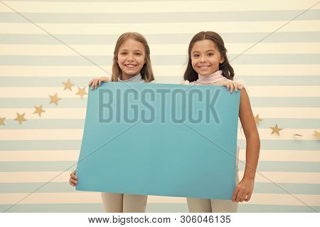 Kids Announcement Concept. Amazing Surprising News. Girl Hold Announcement Banner. Girls Kids Holdin