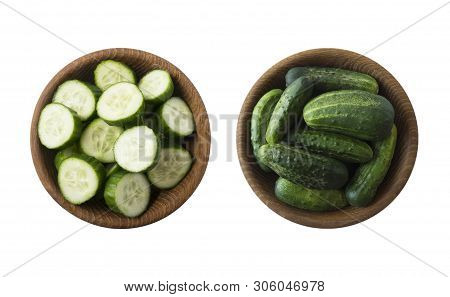 Fresh сucumbers In Wooden Bowl Isolated On White Background. Top View. Cucumbers With Copy Space For