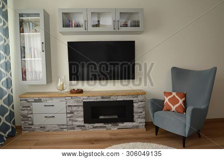 Biofireplace And Chair In A Living Room Interior. Scandinavian Style