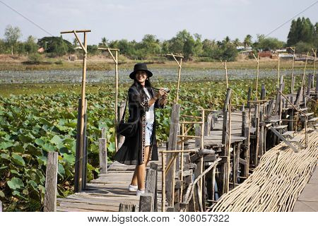Travelers Thai Women People Travel Visit And Posing Portrait For Take Photo On Kae Dam Long Wood Bri