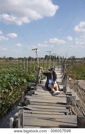 Travelers Thai Women People Travel Visit And Posing Portrait For Take Photo On Kae Dam Long Wood Bri
