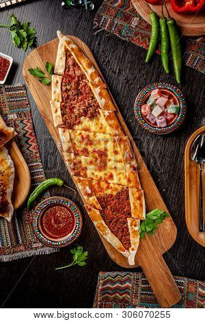 Traditional Turkish Cuisine. Turkish Pizza Pita With A Different Stuffing, Meat, Cheese, Slices Of V
