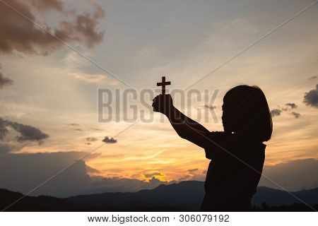 Hand Of A Girl Holding A Cross At Sunrise, Eucharist Therapy Bless God Helping Repent Catholic Easte
