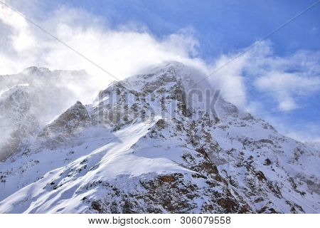View Of The Snow-capped Mountain Top And Blue Sky At The Foot Of Mount Elbrus In The Azau Valley In 