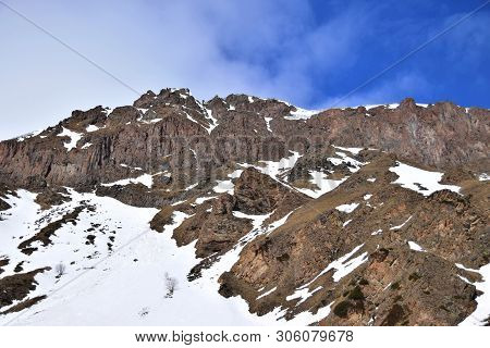 View Of The Mountain Range With Snow And Blue Sky At The Foot Of Mount Elbrus In The Azau Valley In 