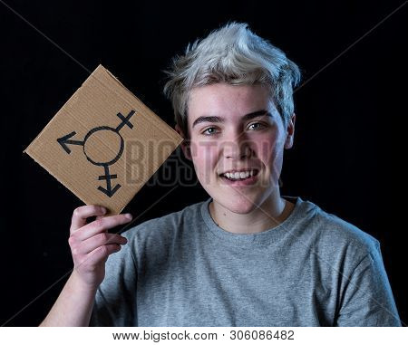 Portrait Of Happy Proud And Confident Trans Teenager Man Holding Transgender Symbol