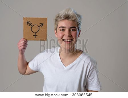 Portrait Of Happy Proud And Confident Trans Teenager Man Holding Transgender Symbol