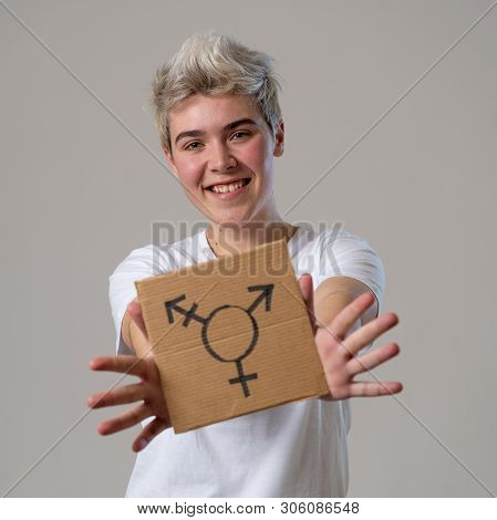 Good Looking Happy And Proud Trans Teenager Holding The Symbol Of The Transgender Drawn On A Cardboa