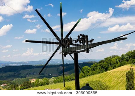 vineyard with windmill called klapotetz in south of Styria, Austria