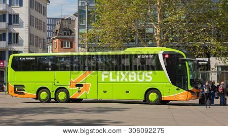 Zurich, Switzerland - May 27, 2019: A Flixbus Bus At A Bus Station In The City Of Zurich, People At 
