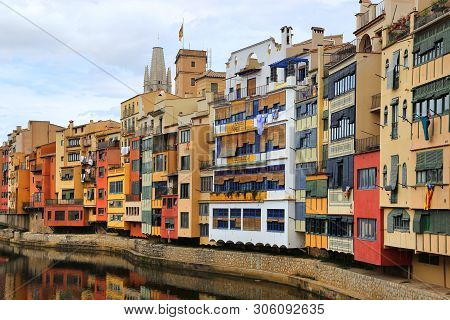 Colorful Houses And Eiffel Bridge (pont De Les Peixateries Velles) Reflected In Water River Onyar, B