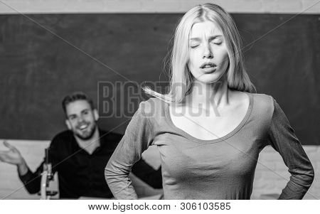 Stumbling Through A Lesson. Cute Woman Standing In Classroom With Teacher. University Or College Stu