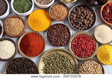 Aromatic Spices And Herbs In Metal And Ceramic Bowls. Top View.