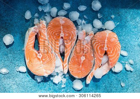 Clipping Path Fresh Salmon Steak On Concrete Blue Background With Basil And Iced. Salmon Red Fish St