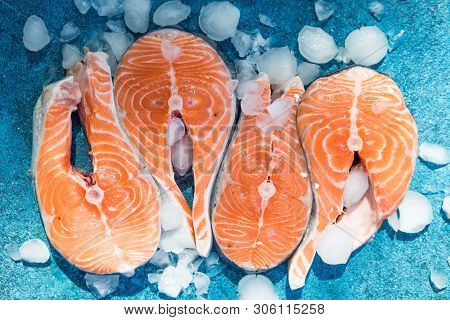 Clipping Path Fresh Salmon Steak On Concrete Blue Background With Basil And Iced. Salmon Red Fish St