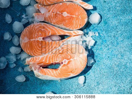 Clipping Path Fresh Salmon Steak On Concrete Blue Background With Basil And Iced. Salmon Red Fish St