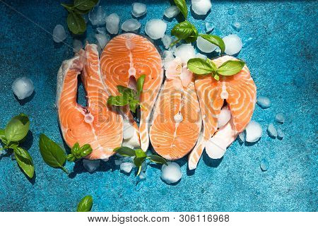 Clipping Path Fresh Salmon Steak On Concrete Blue Background With Basil And Iced. Salmon Red Fish St
