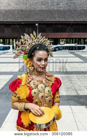 Makassar, Sulawesi, Indonesia - February 28, 2019: Closeup Of Young Woman In Traditional Local Garb.