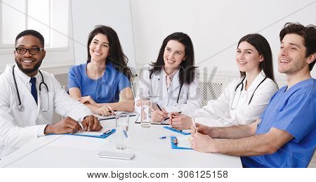 Educational Seminar. Successful Interns And Doctors Listening Lecture At Conference In Hospital