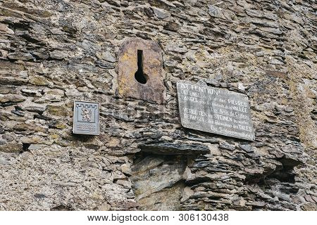 Vianden, Luxembourg - May 18, 2019: Signs On A Wall Of Vianden Castle, Luxembourg, One Of The Larges