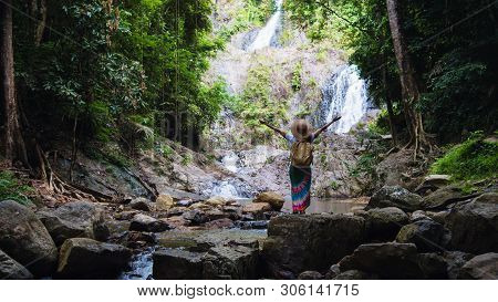 Asian Women Relax In The Holiday. Travel Waterfall On The Moutain (huai Toh Waterfall) At Krabi. Tra