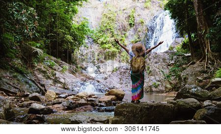 Asian Women Relax In The Holiday. Travel Waterfall On The Moutain (huai Toh Waterfall) At Krabi. Tra