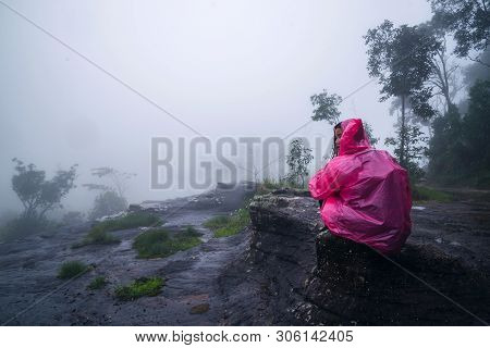 Tourist With Pink Rain Coat Stand View The Scenery Natural Beautiful Touch Fog At Phu Hin Rong Kla N